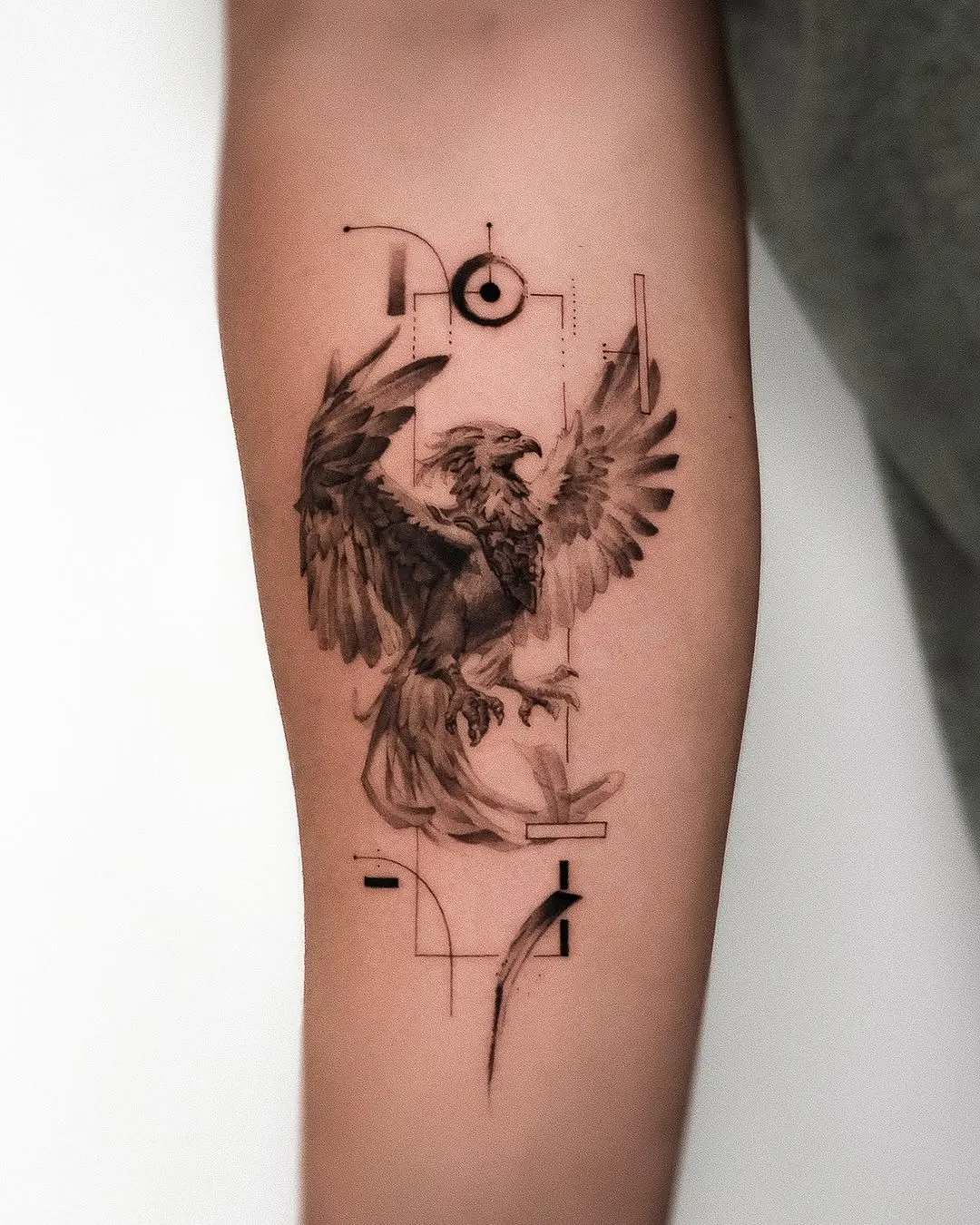 Artistic phoenix tattoo with intricate details