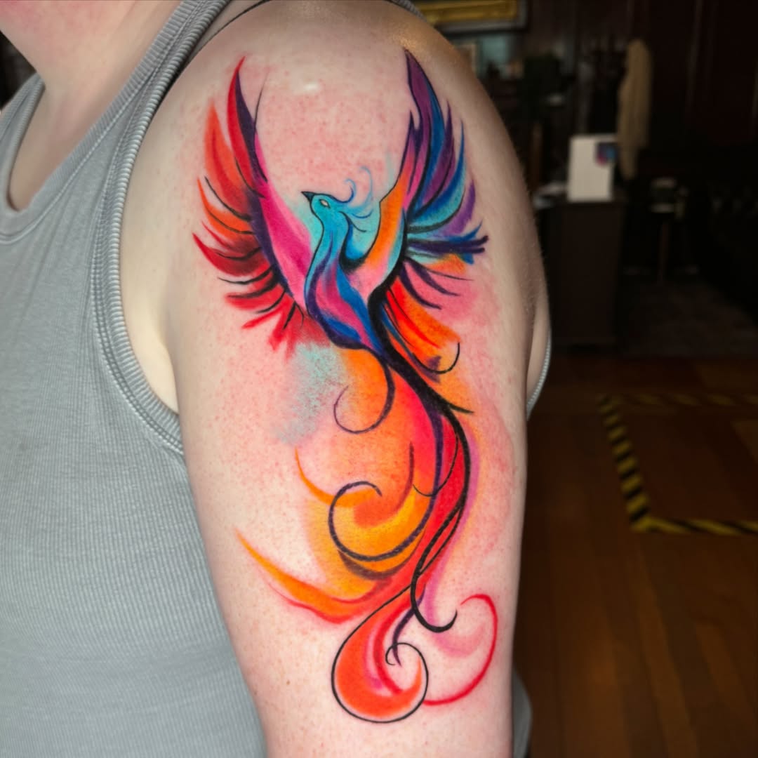 Vibrant Phoenix Tattoo with Colorful Flames