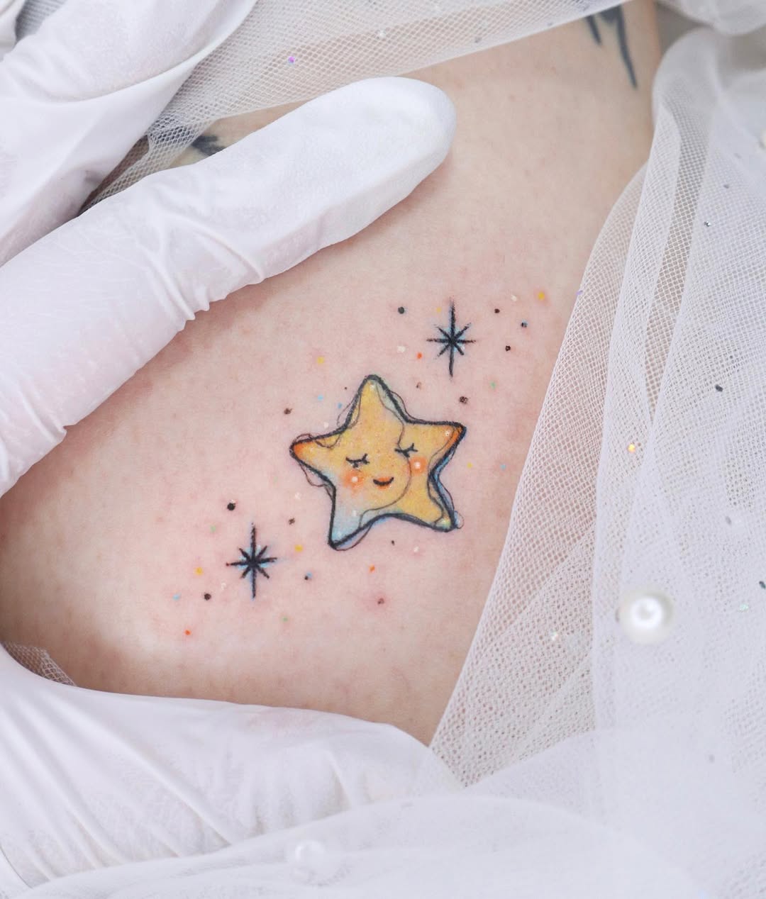 A cute star tattoo with whimsical vibes.