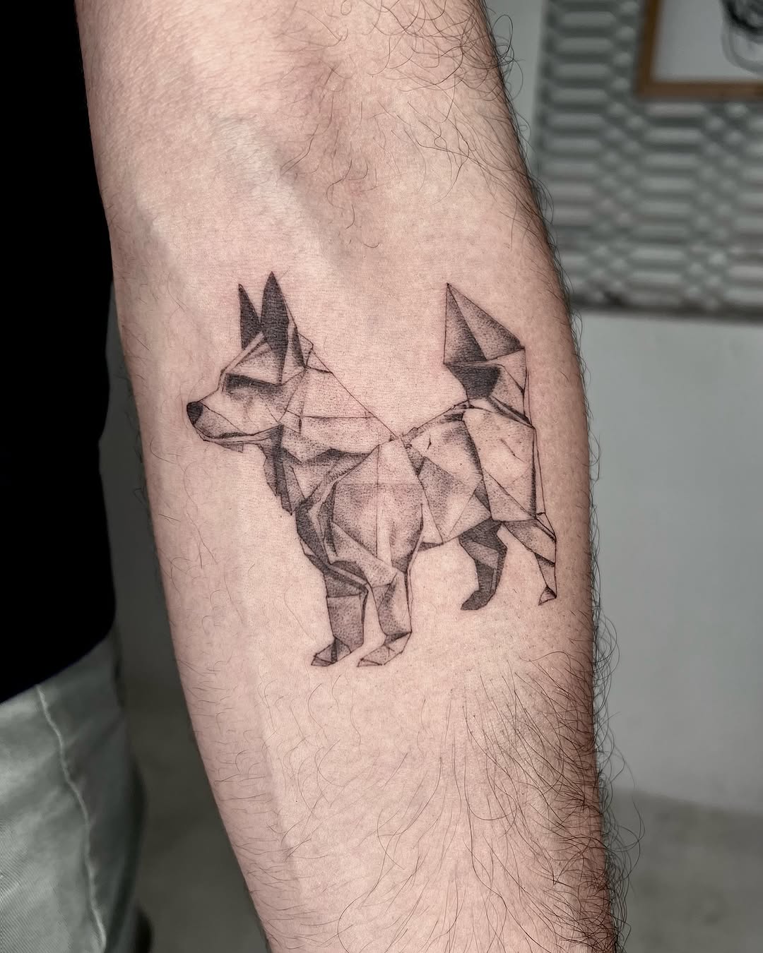 Stylish geometric dog tattoo with sharp lines