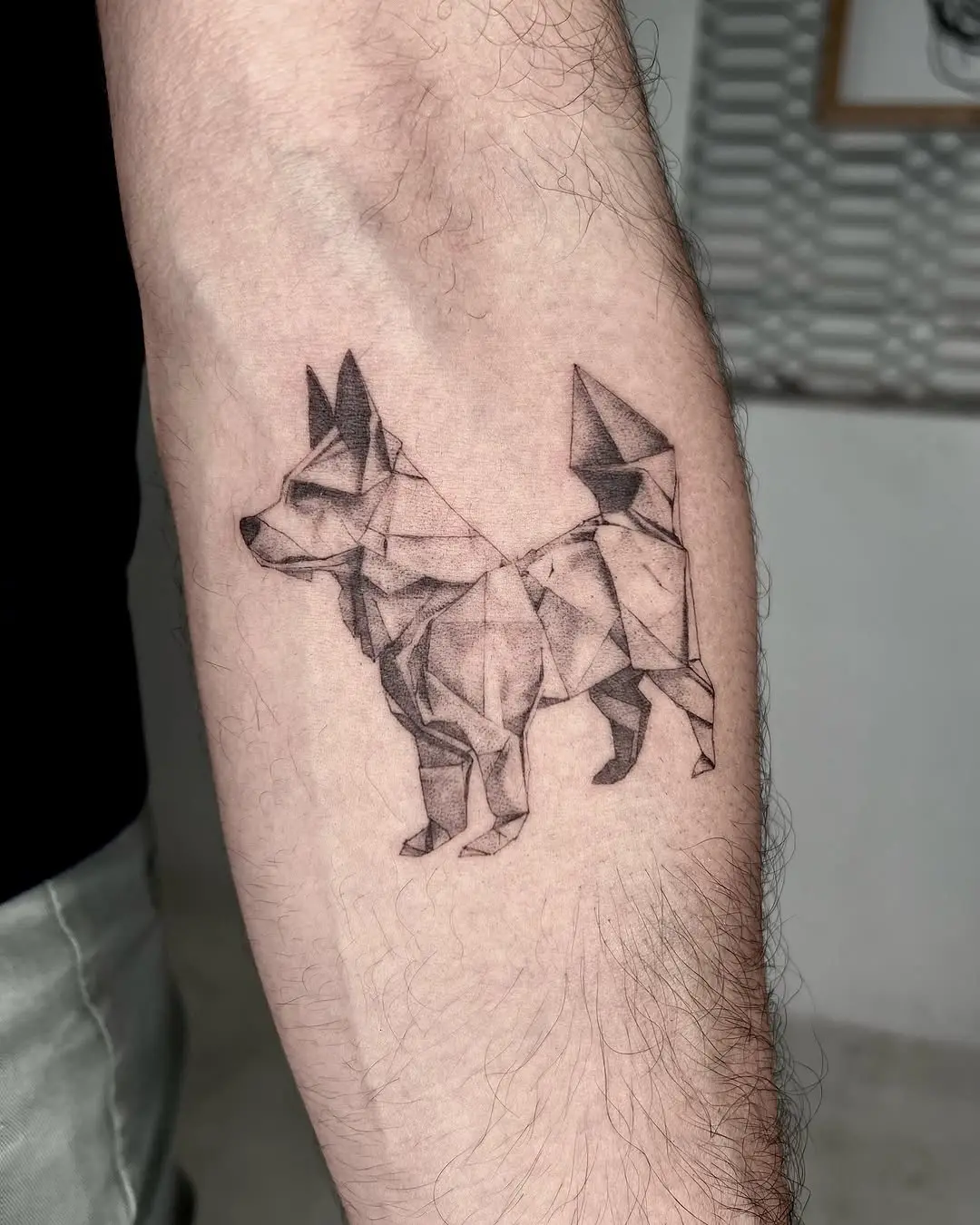 Stylish geometric dog tattoo with sharp lines