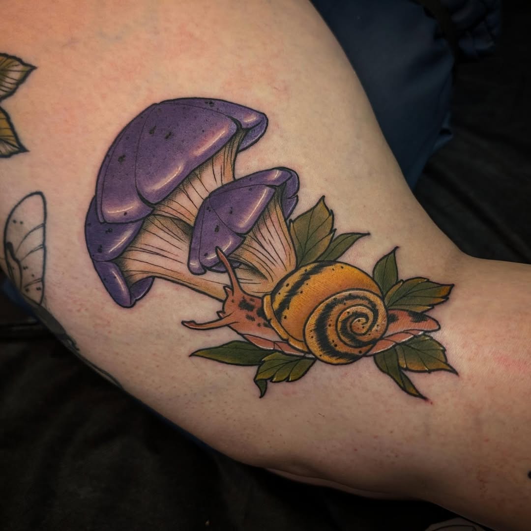 Vibrant purple mushroom and snail tattoo design