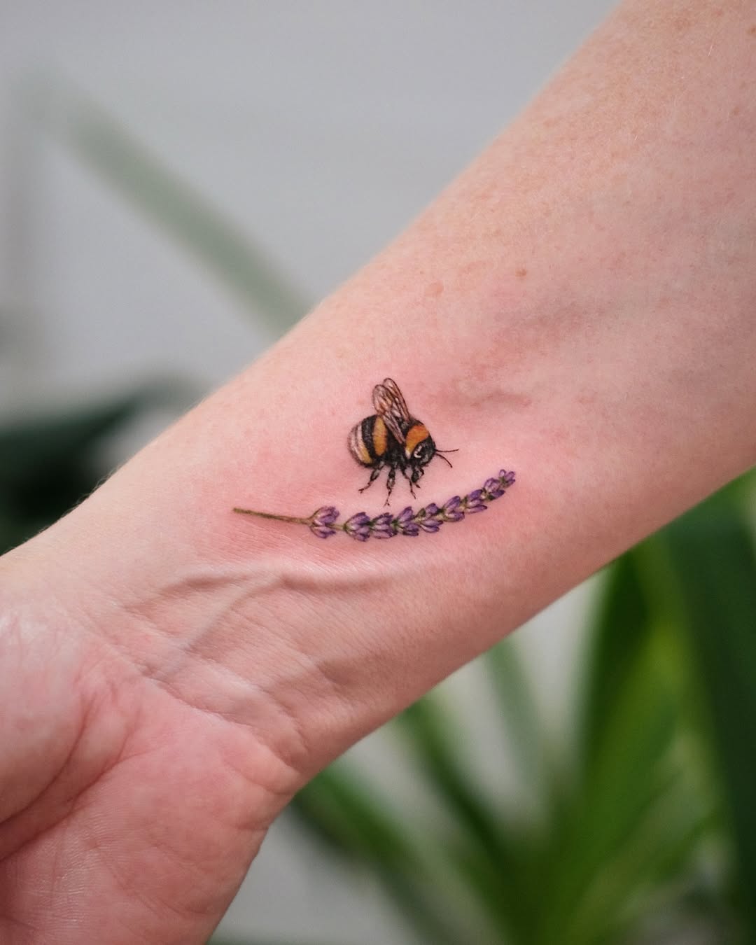 Stunning bee tattoo with lavender accent