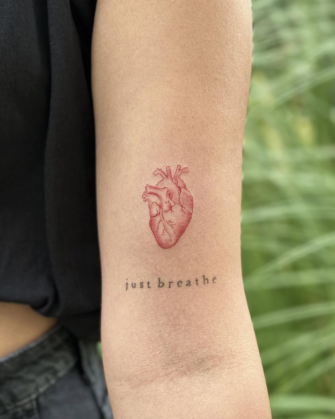 Unique heart tattoo with motivational phrase