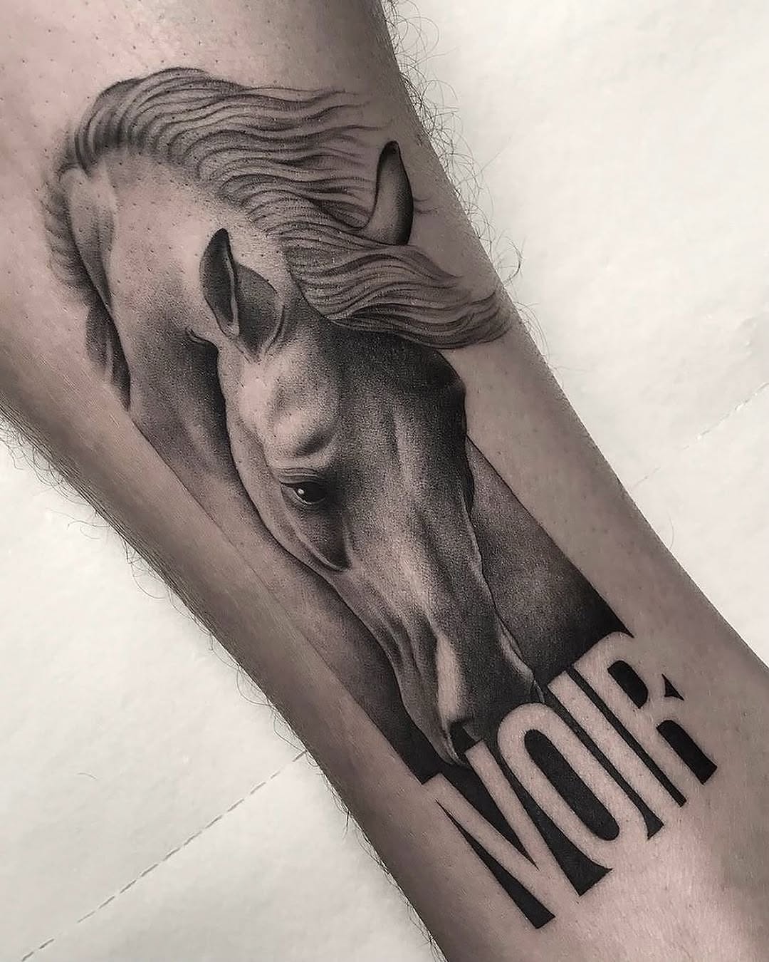 Stunning realistic horse tattoo in black and gray