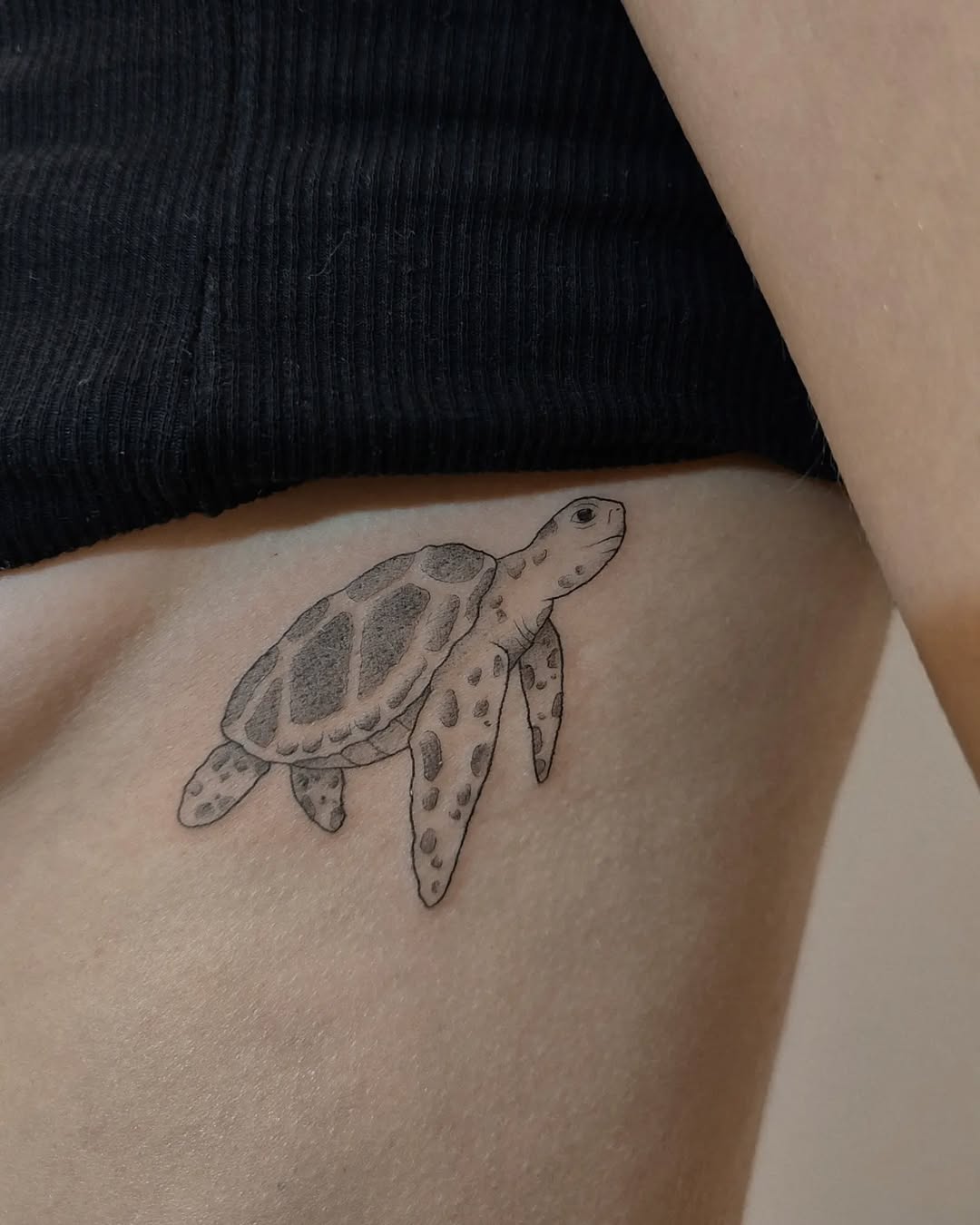 Elegant minimalist sea turtle tattoo design