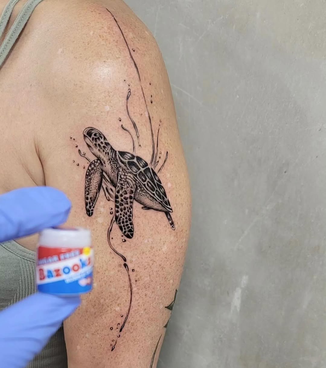 Beautiful sea turtle tattoo with water elements