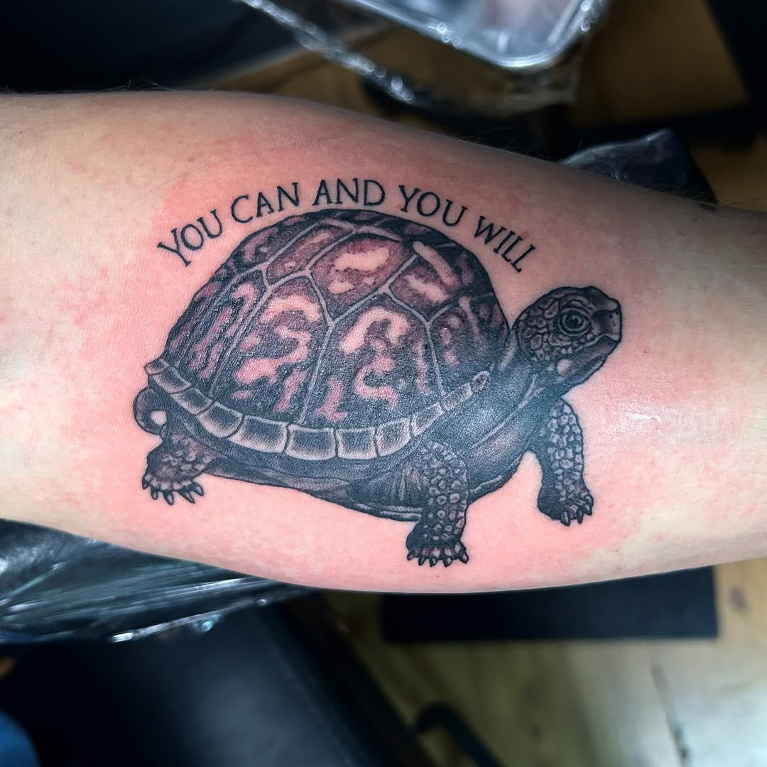 Realistic turtle tattoo with motivational message