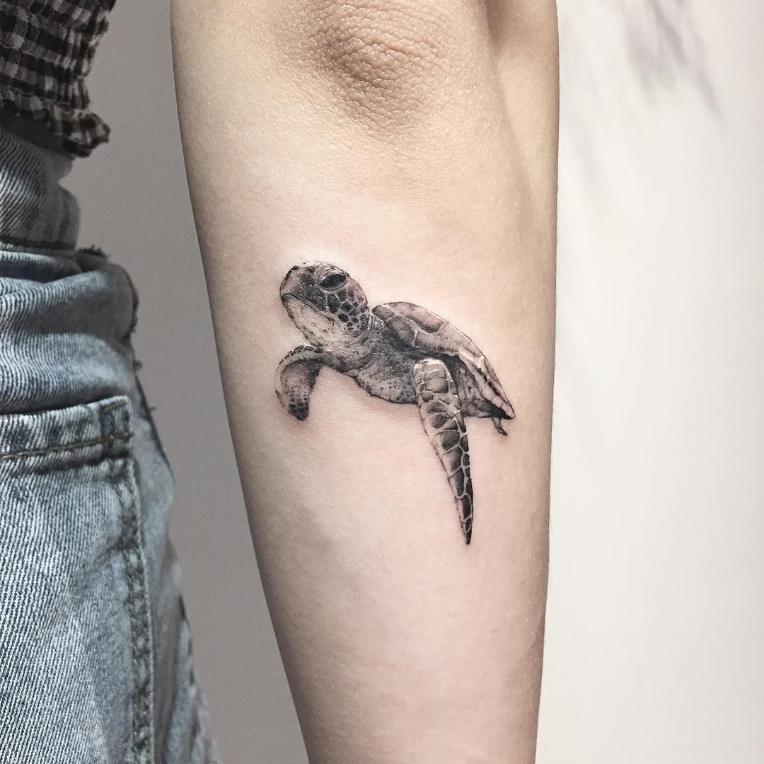 Stunning realistic turtle tattoo on forearm