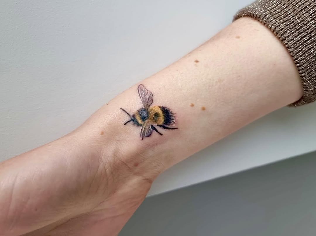 Stunning realistic bumblebee tattoo on wrist
