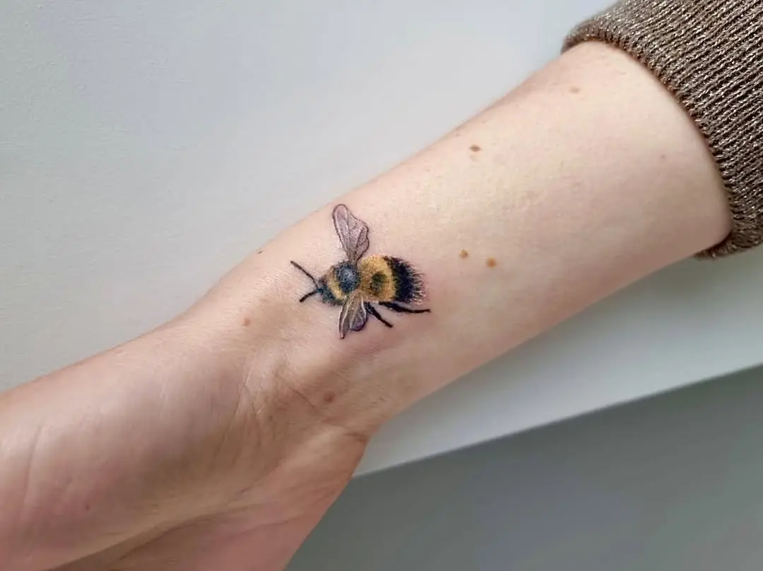 Stunning realistic bumblebee tattoo on wrist