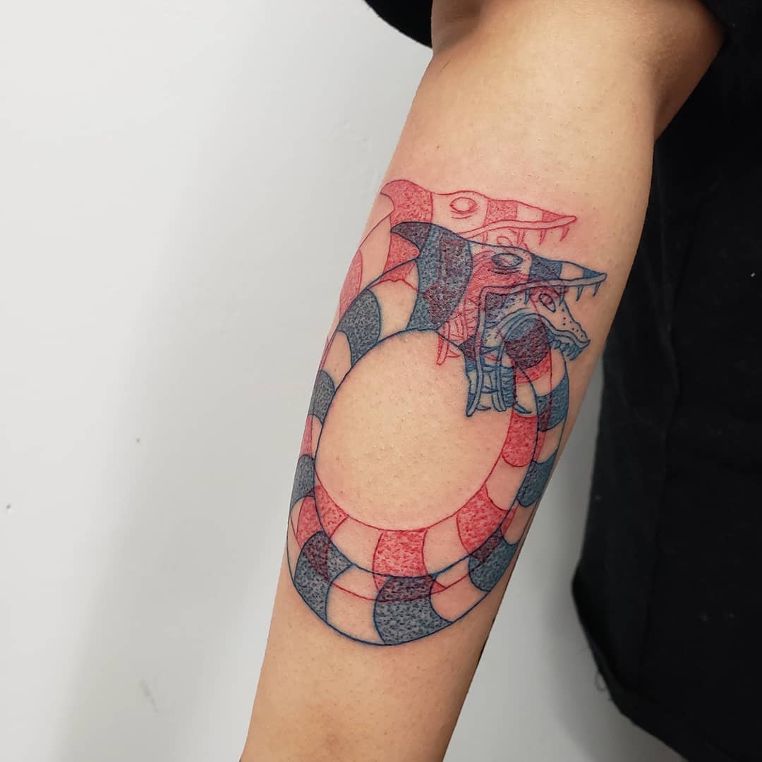 Stylish and intricate ouroboros tattoo design