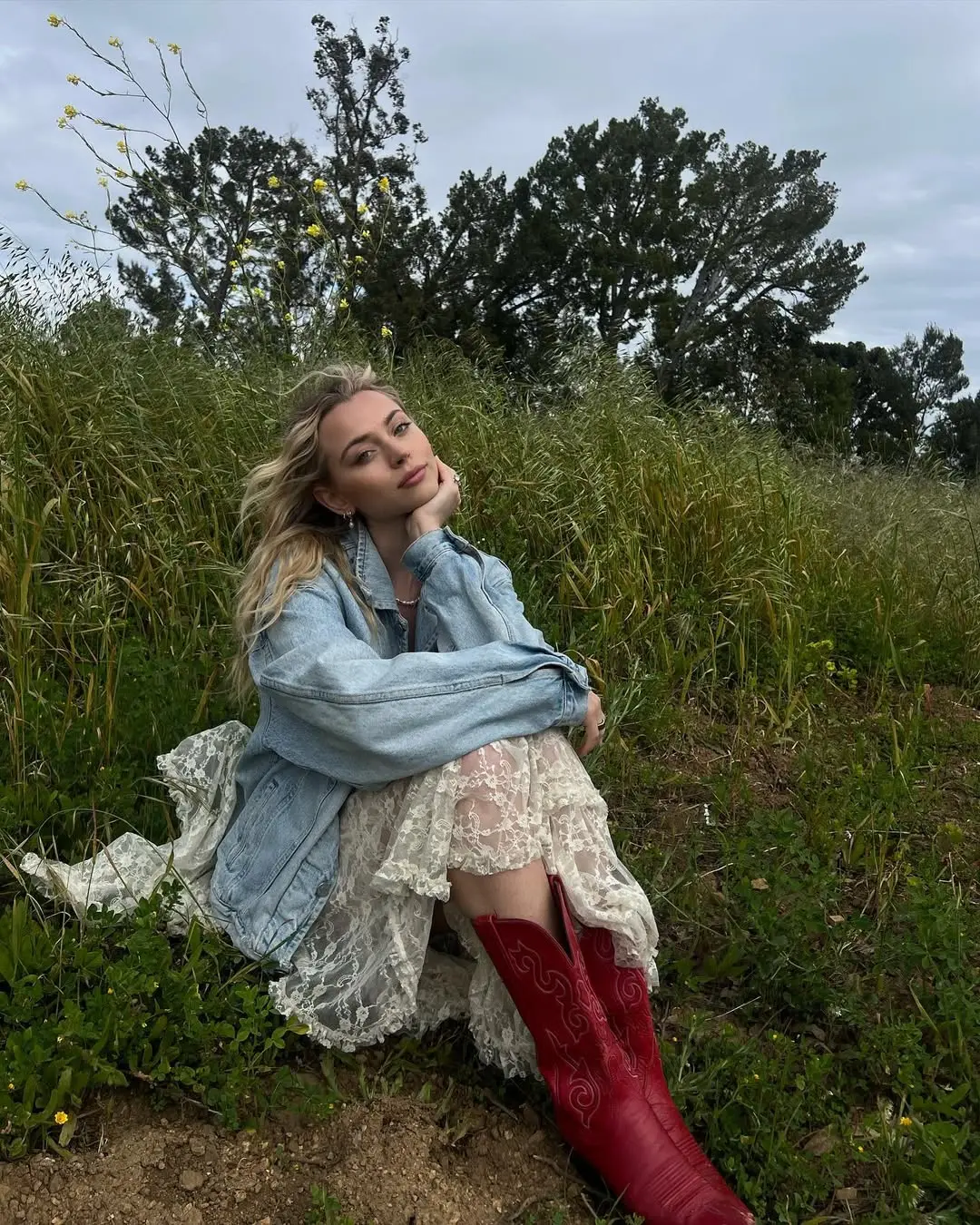 Chic red boots elevate a casual summer look