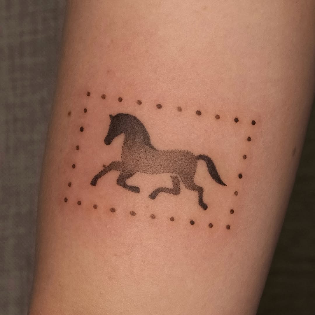 Dynamic horse tattoo in minimalist outline style