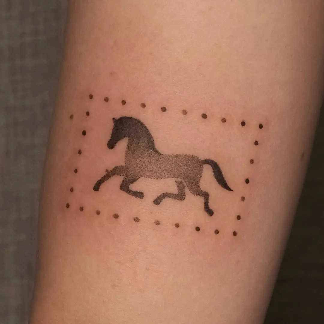 Dynamic horse tattoo in minimalist outline style