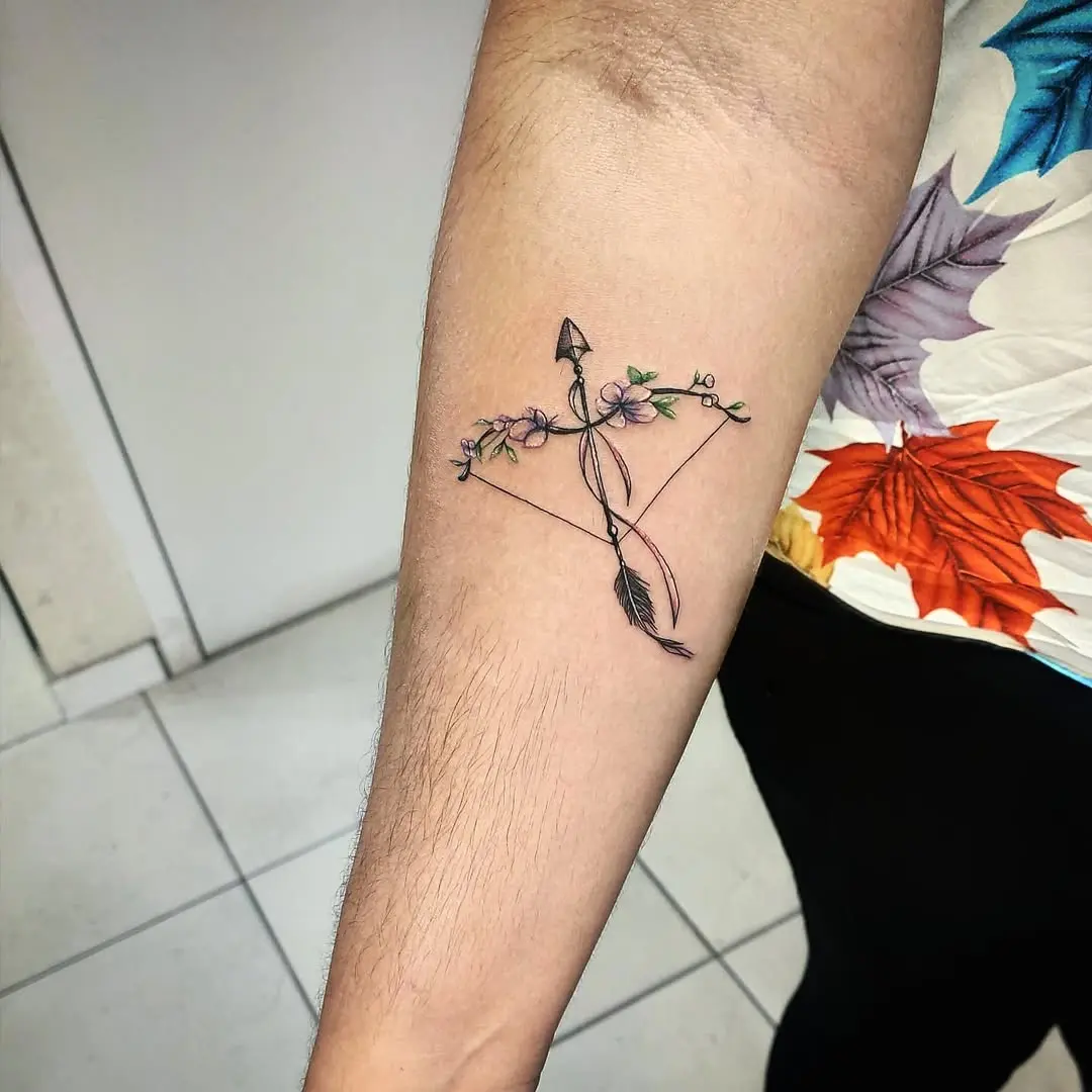 Elegant Sagittarius Tattoo with Floral Accents