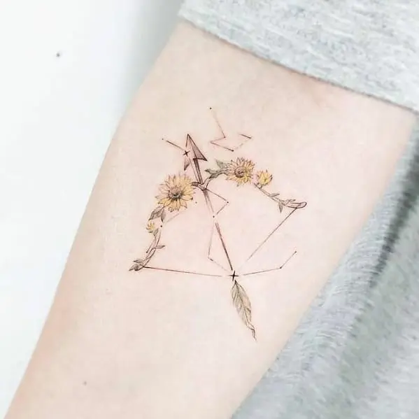 Elegant Sagittarius tattoo with floral accents