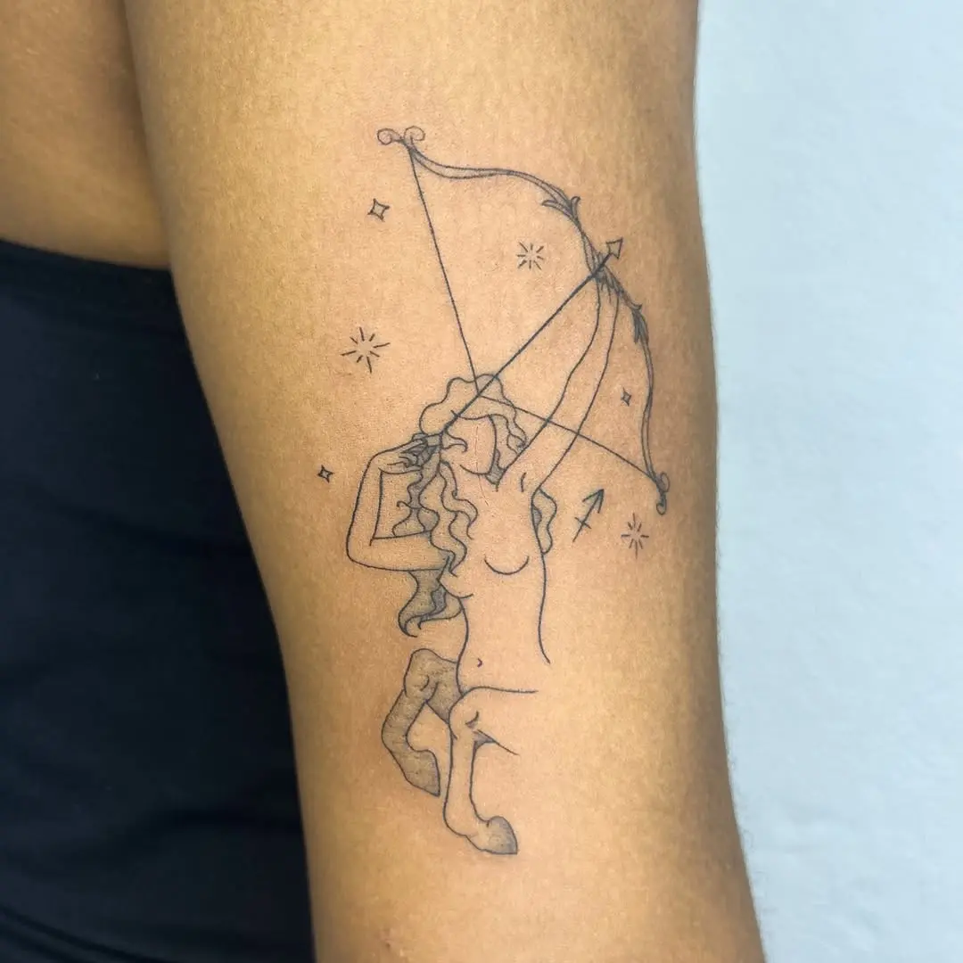 Elegant Sagittarius Tattoo with Celestial Elements