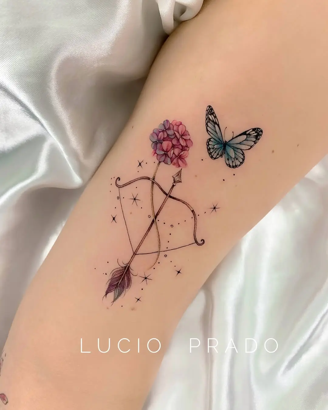 Elegant Sagittarius tattoo with floral and butterfly elements