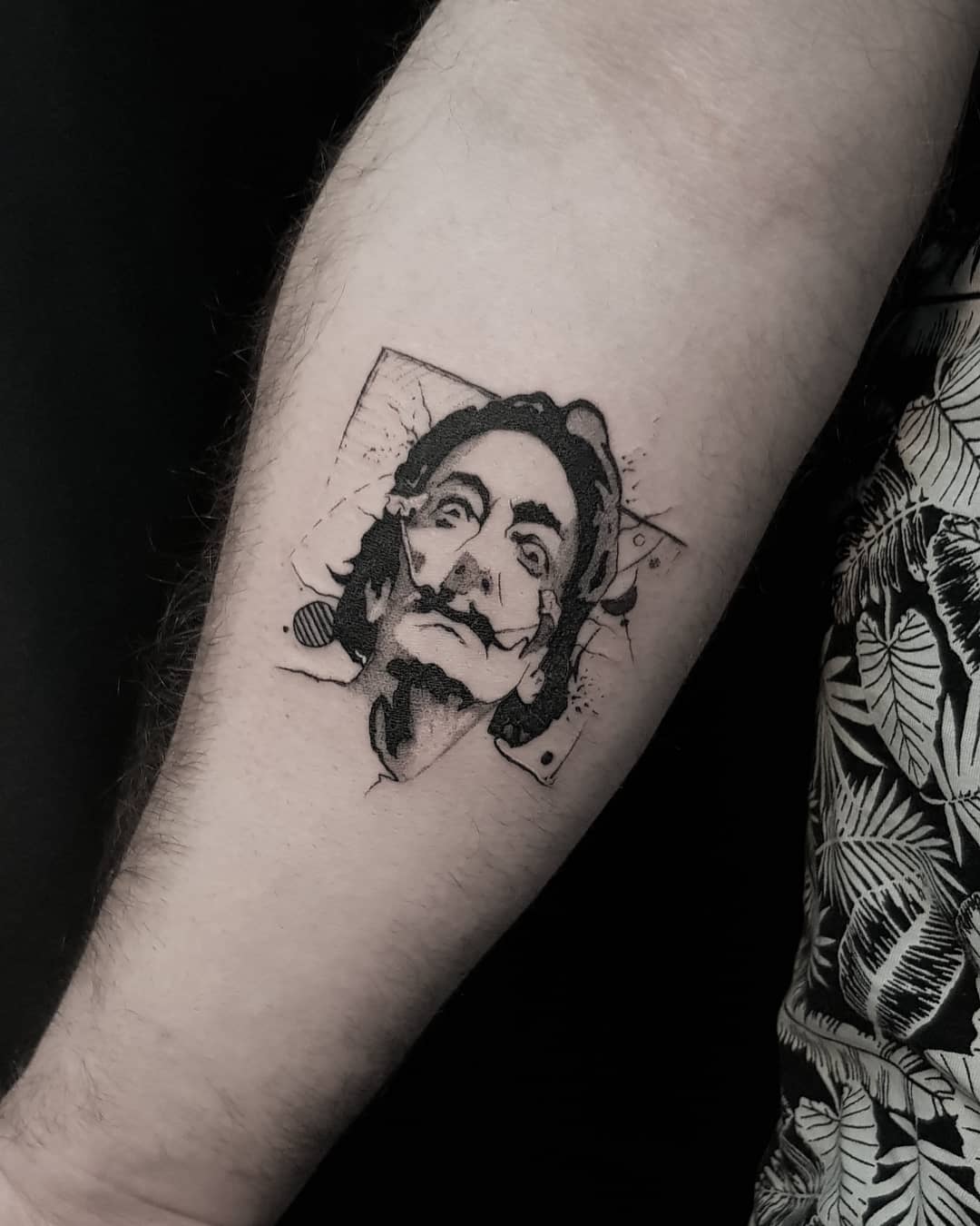 Intriguing Salvador Dali portrait tattoo design