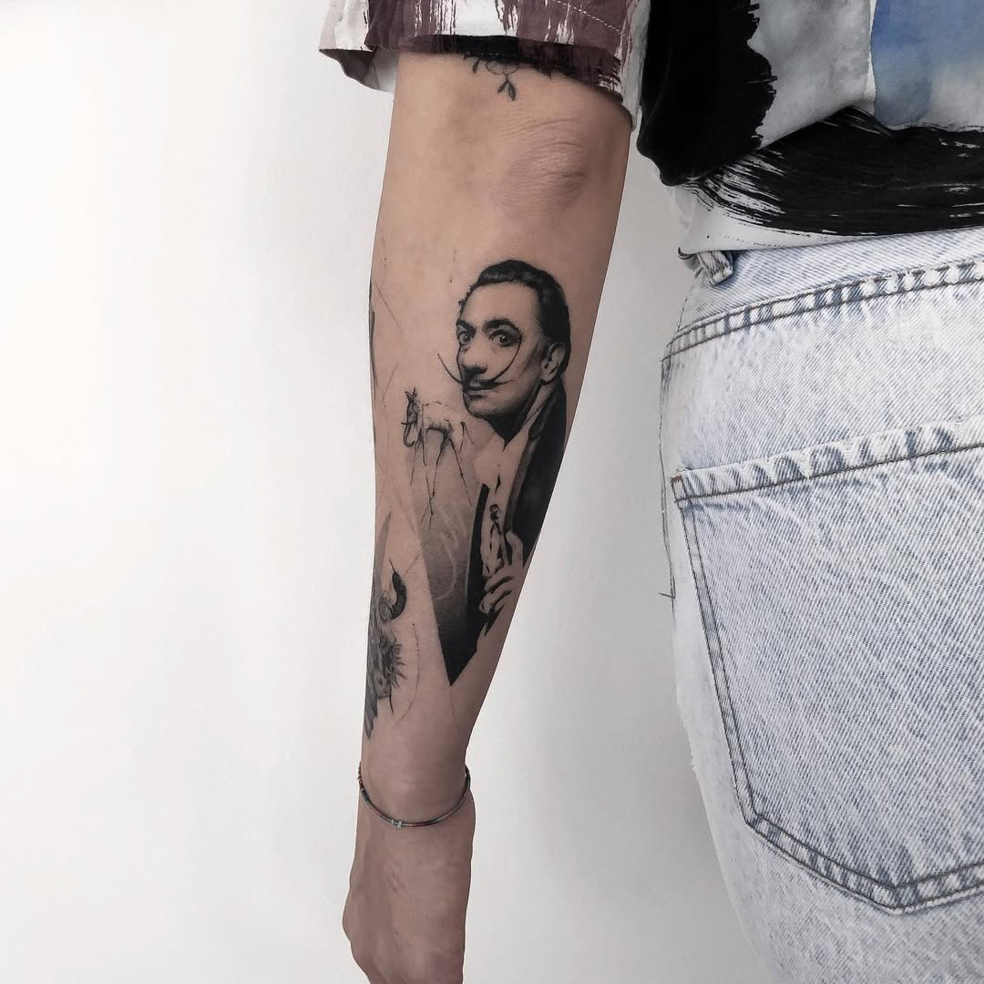 Intricate Salvador Dali Tribute Tattoo on Arm