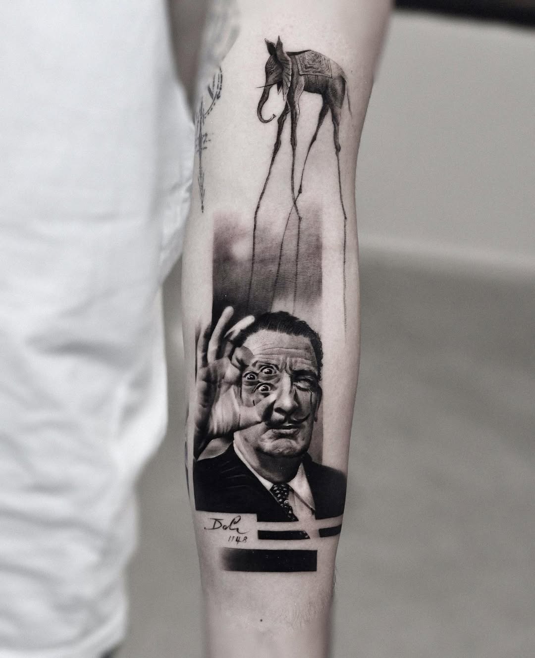 Intricate Salvador Dali tattoo showcasing surrealism