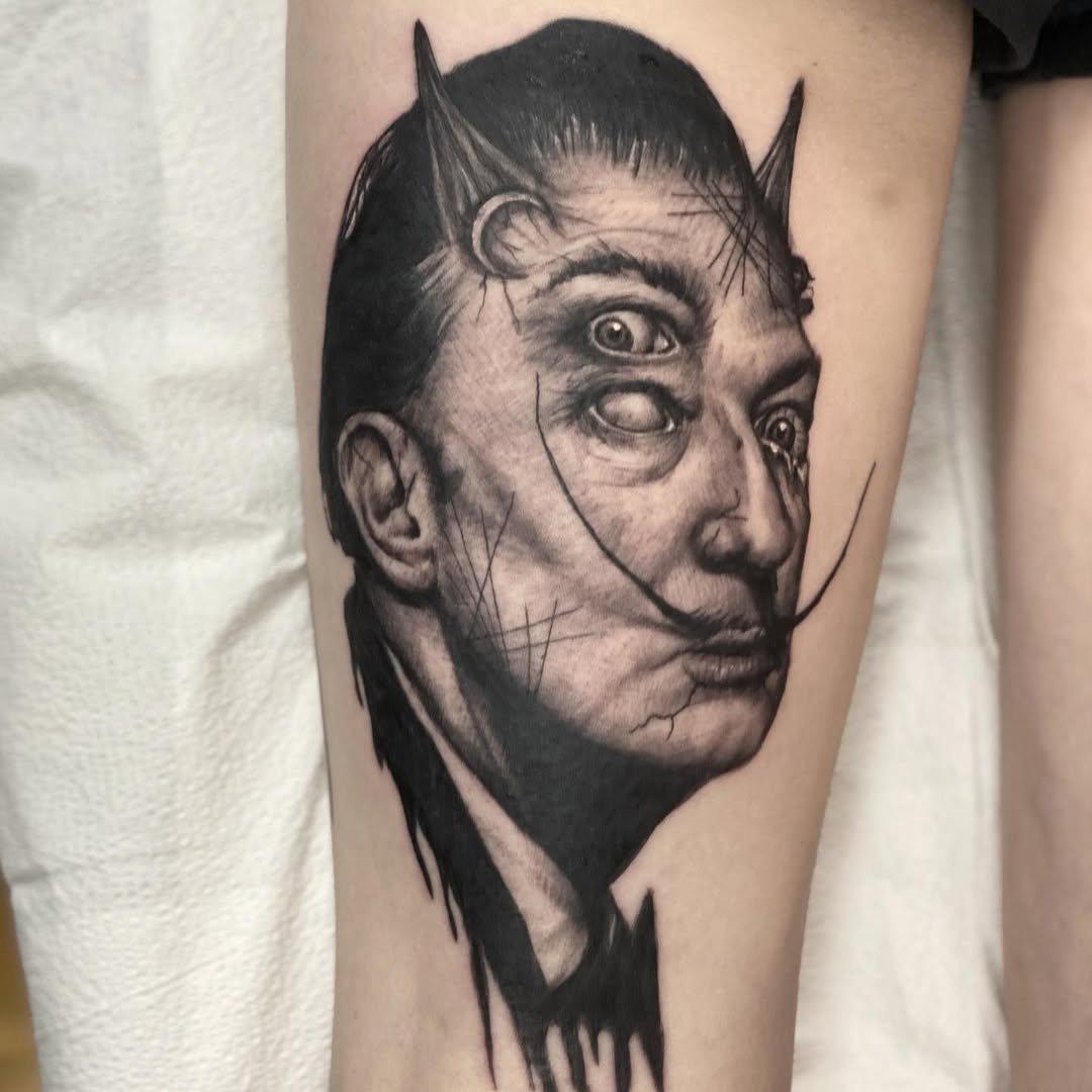 Striking Salvador Dali-inspired blackwork tattoo