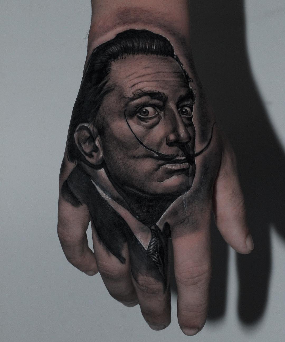 Intricate Salvador Dali Hand Portrait Tattoo