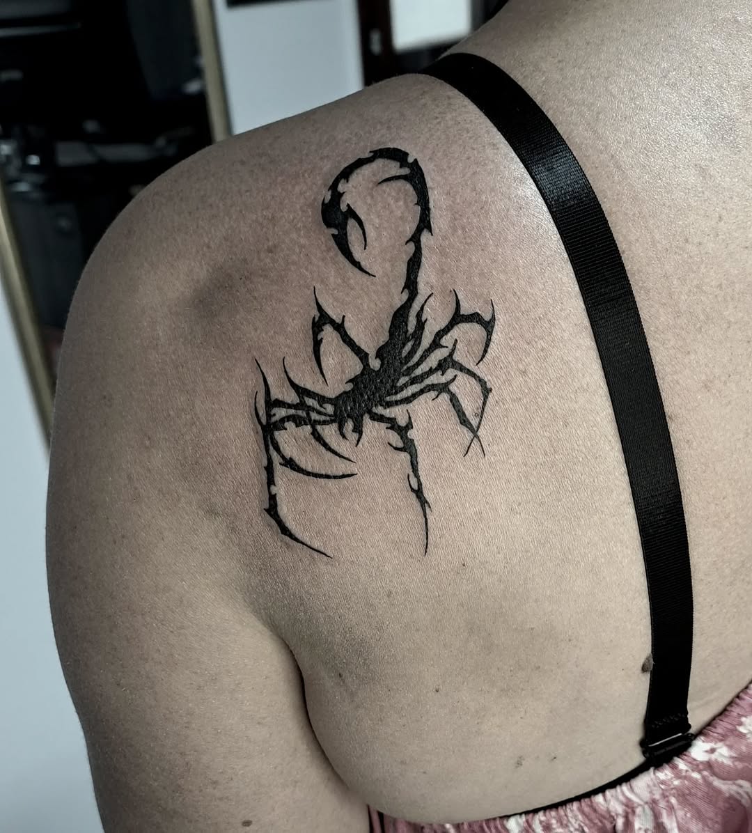 Stylish scorpion tattoo showcasing bold black ink