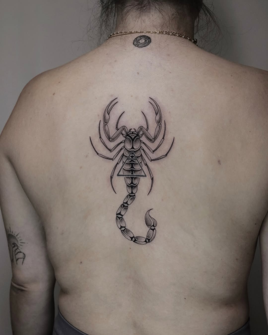 Intricate Scorpio tattoo on the back