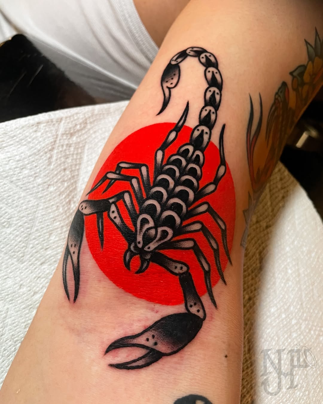 Bold Scorpio Tattoo on Vivid Red Background