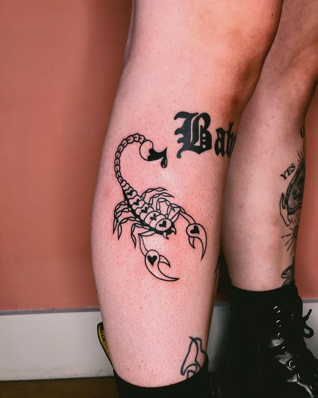 Bold scorpion tattoo with heart details.