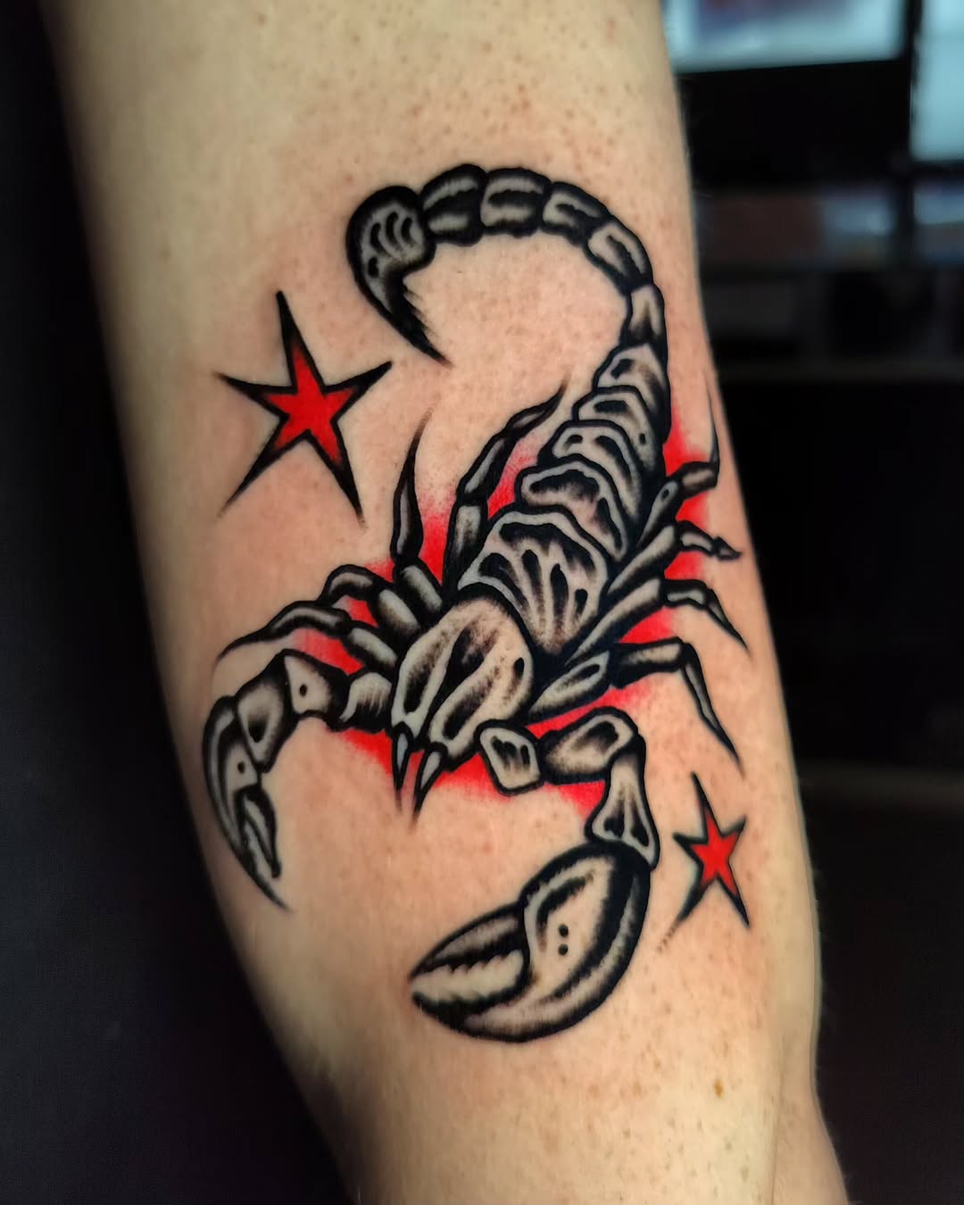 Bold Scorpio Tattoo with Striking Red Accents