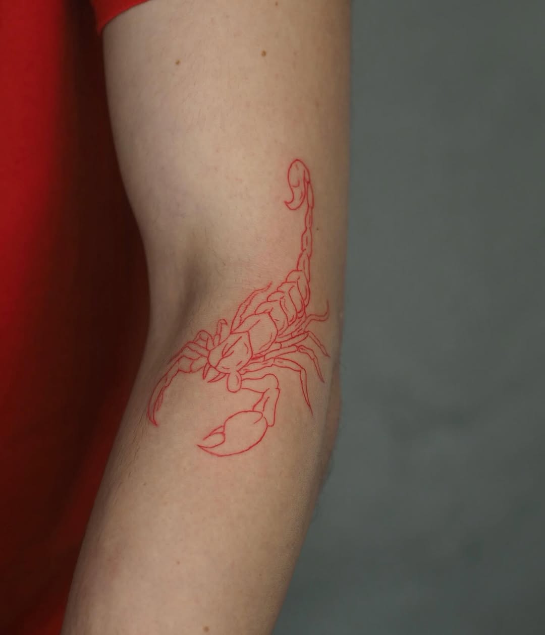 Bold Scorpio Tattoo in Striking Red Ink