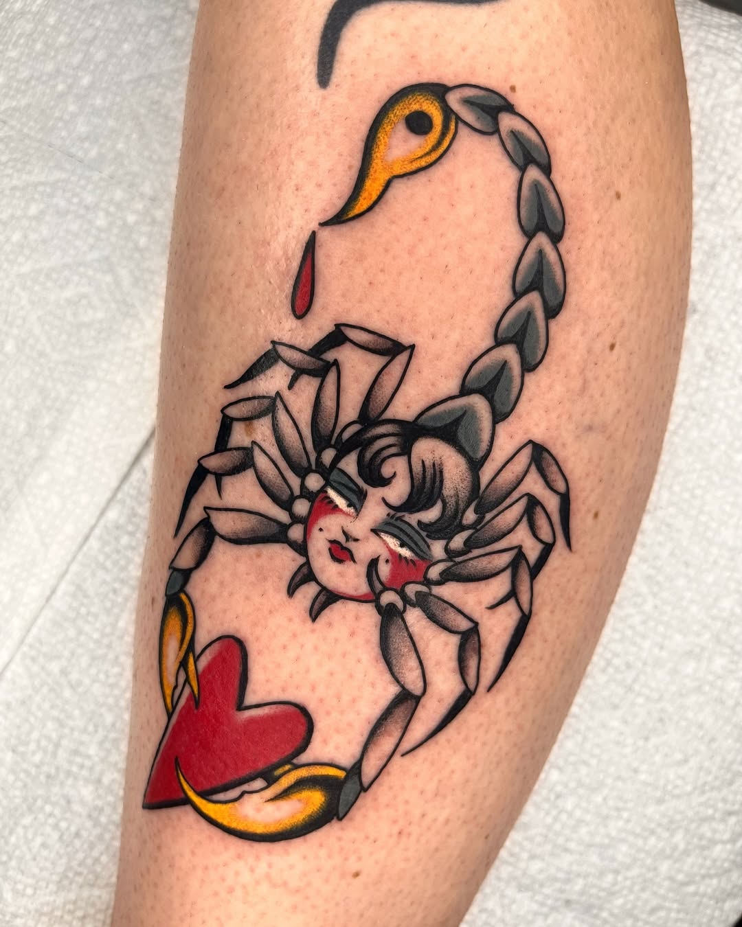 Whimsical Scorpio tattoo with heart motif