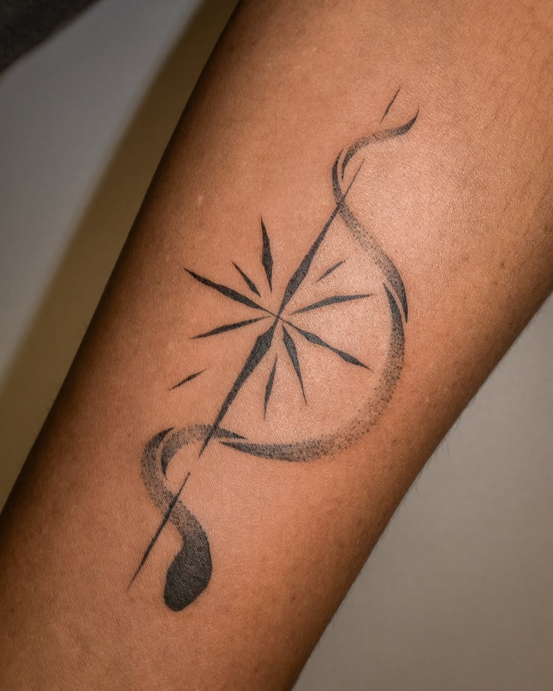 Stylish star tattoo with elegant curves