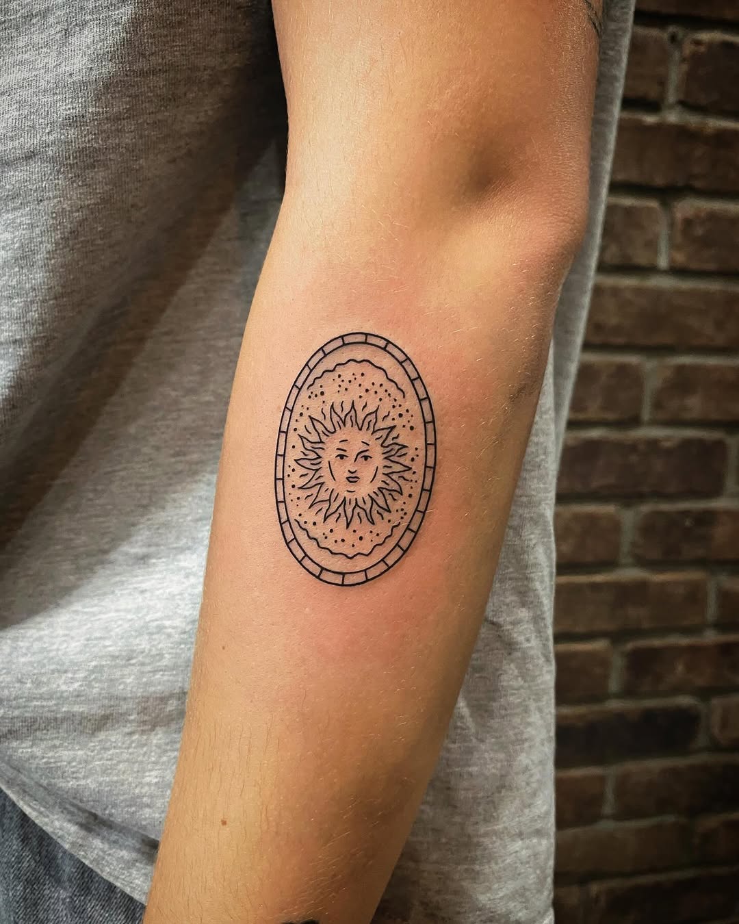 Intricate Sun Star Tattoo on the Arm