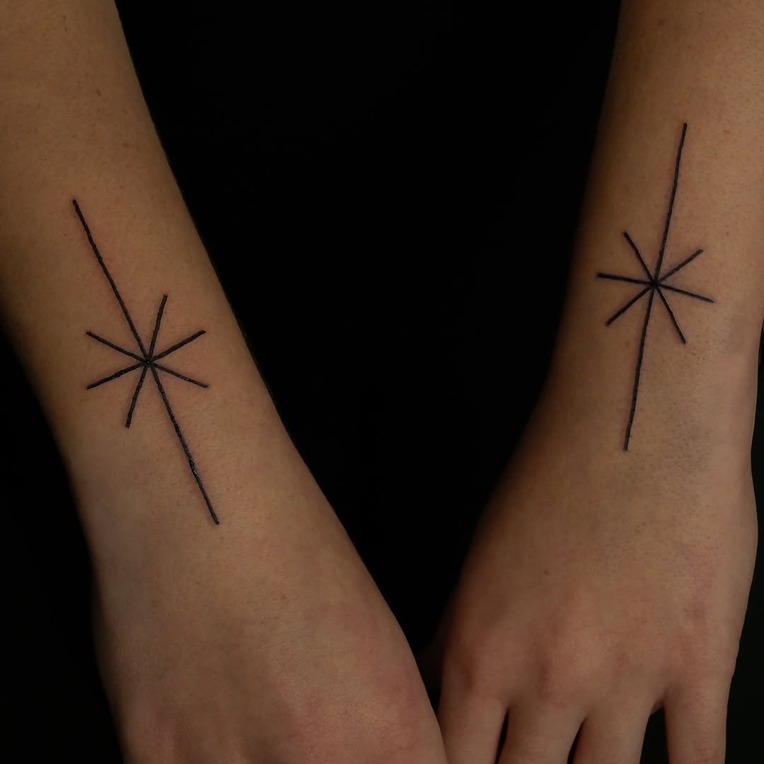 Stylish minimalist star tattoos on forearms