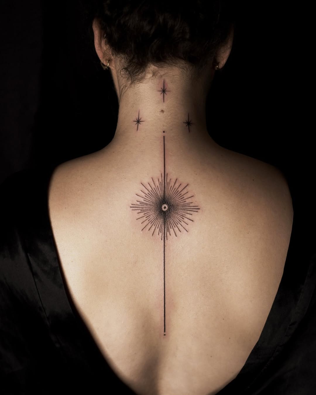 Elegant star tattoo design on the back