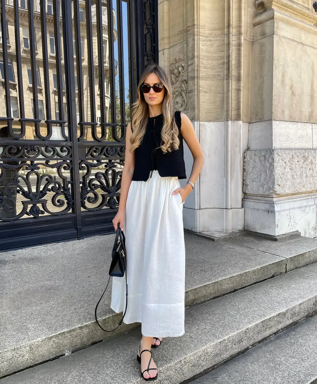 Chic black top paired with flowy white skirt