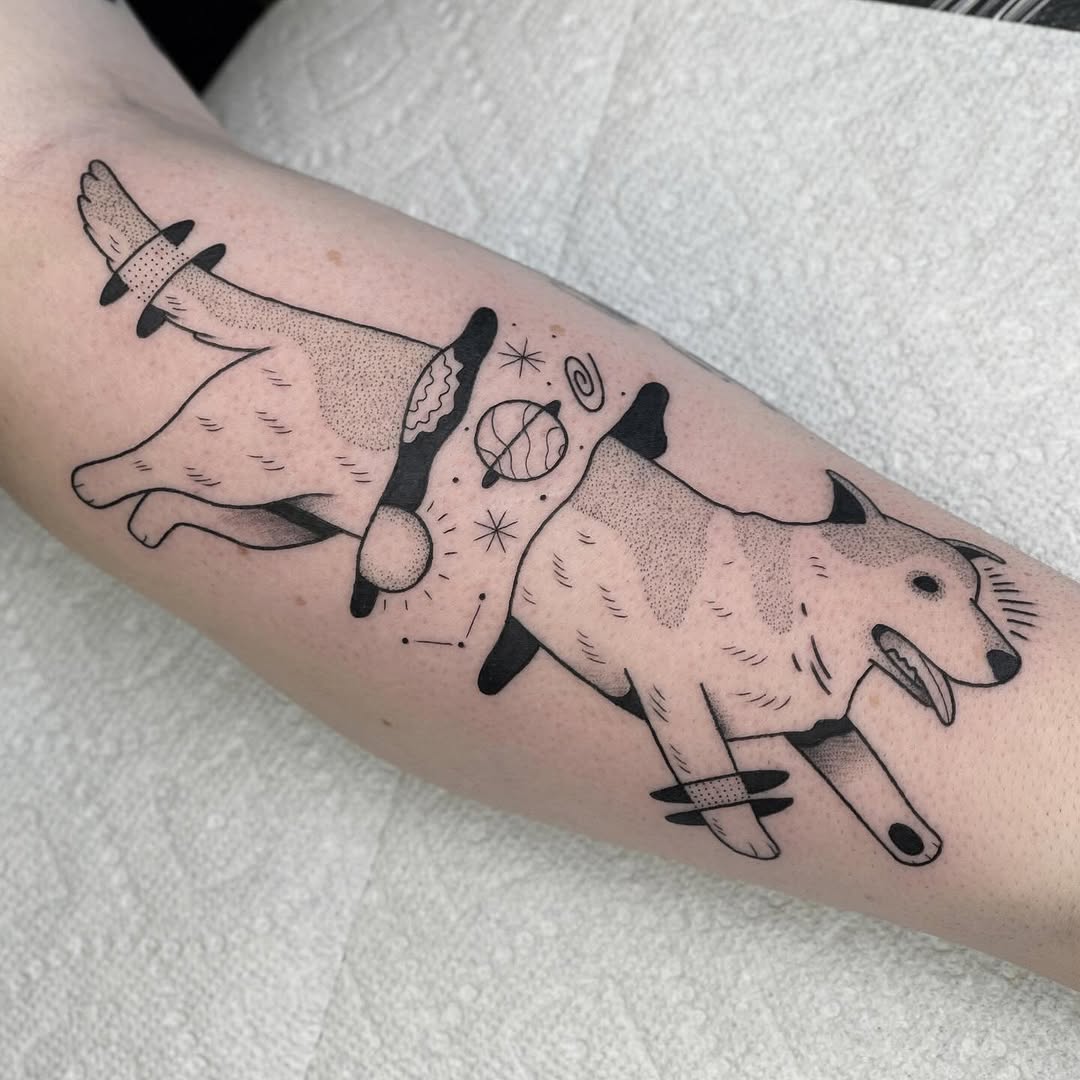 Artistic Dog Tattoo Featuring Cosmic Elements