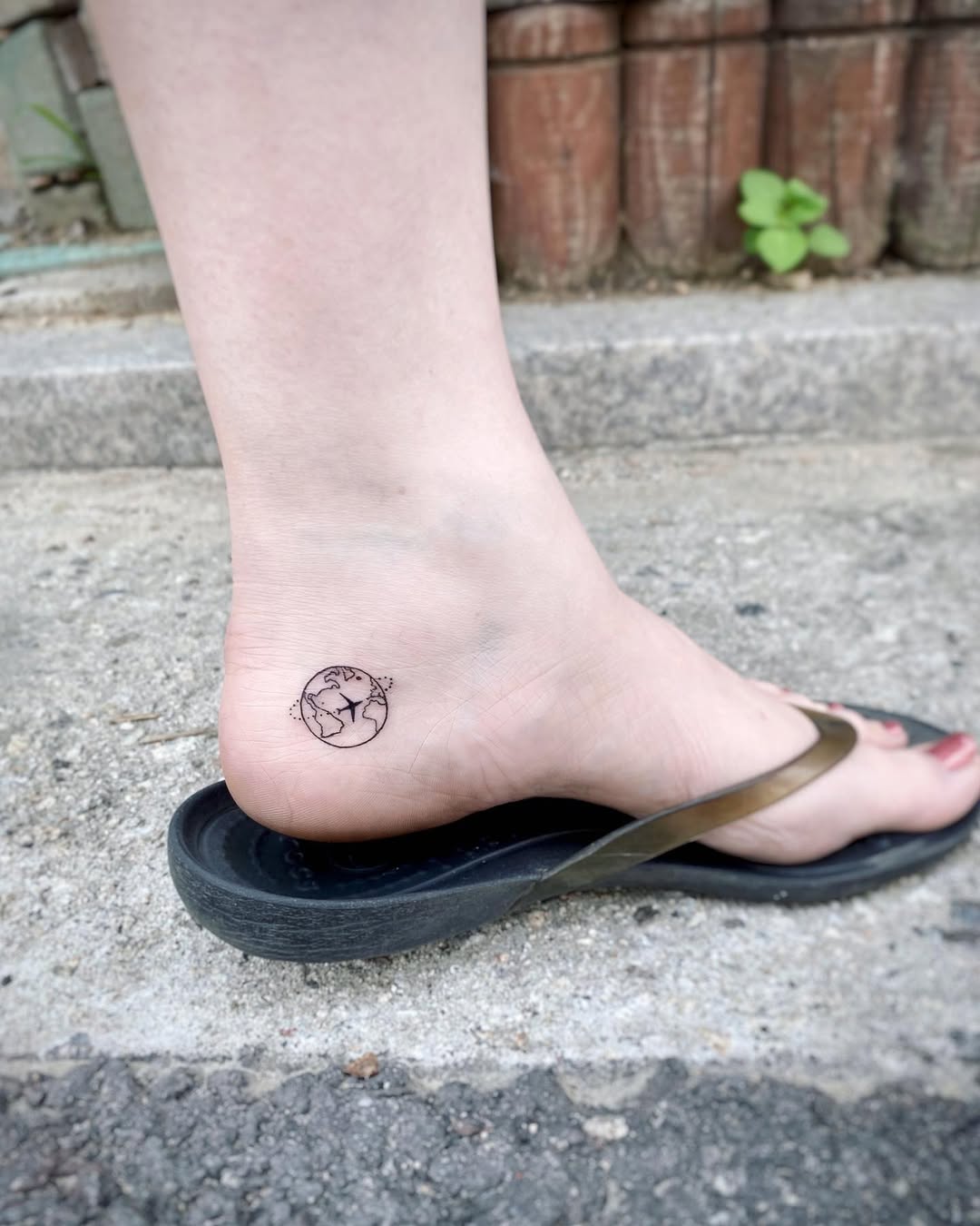 Minimalist Earth Tattoo on Ankle