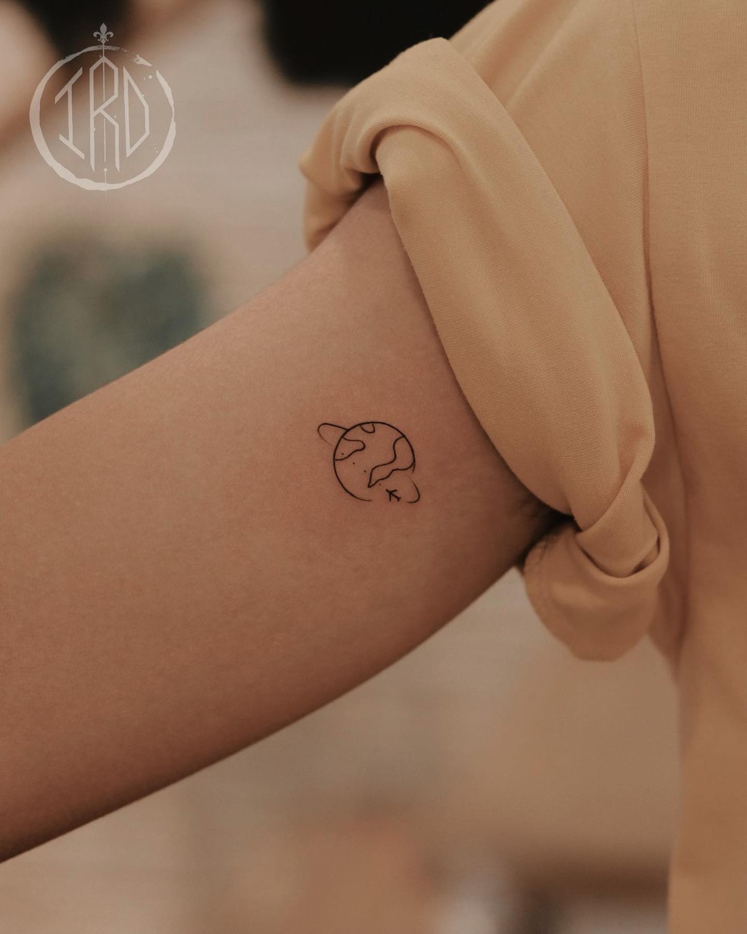 Minimalist Earth Tattoo for Wanderlust Souls