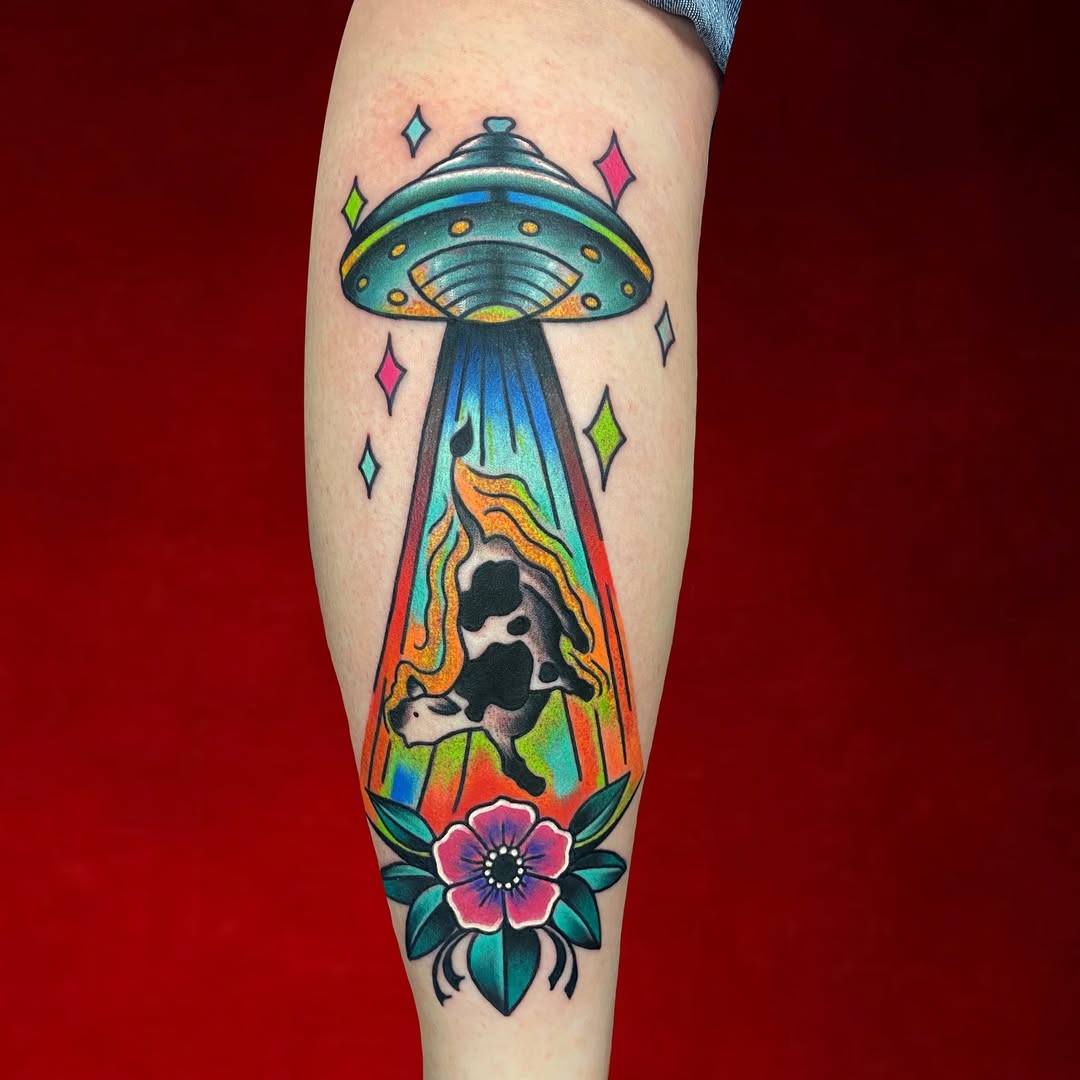 Whimsical UFO Tattoo with a Cow and Flowers