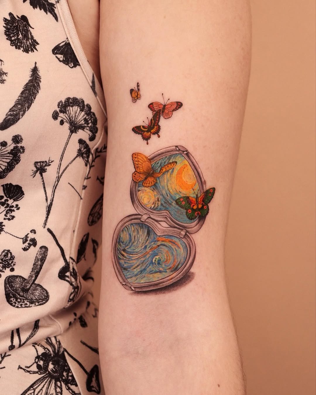 Whimsical heart tattoo with butterflies design