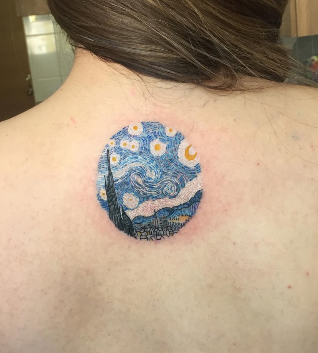 A stunning Van Gogh-inspired tattoo design.