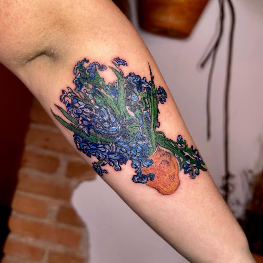 Vibrant Flower Pot Tattoo with Blue Blooms