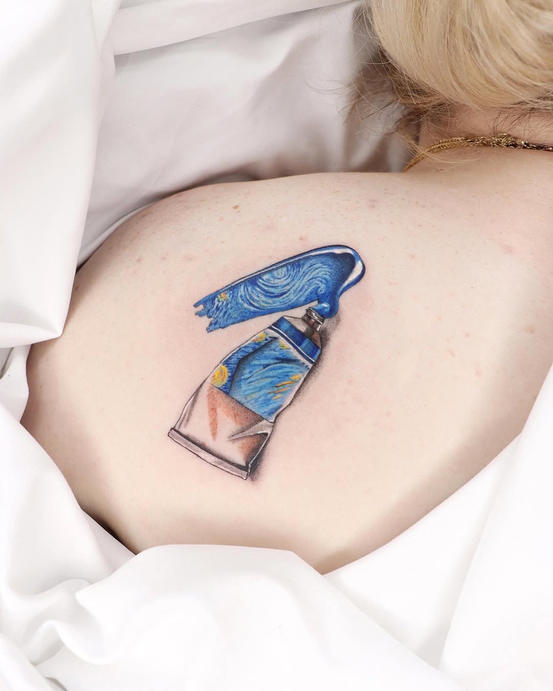 Colorful Van Gogh palette tattoo on back