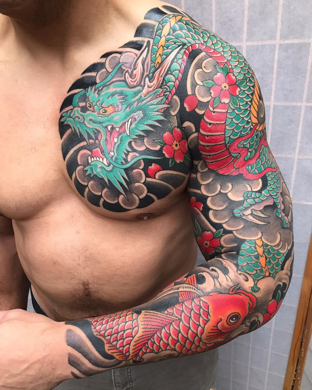 Stunning dragon and koi fish tattoo design