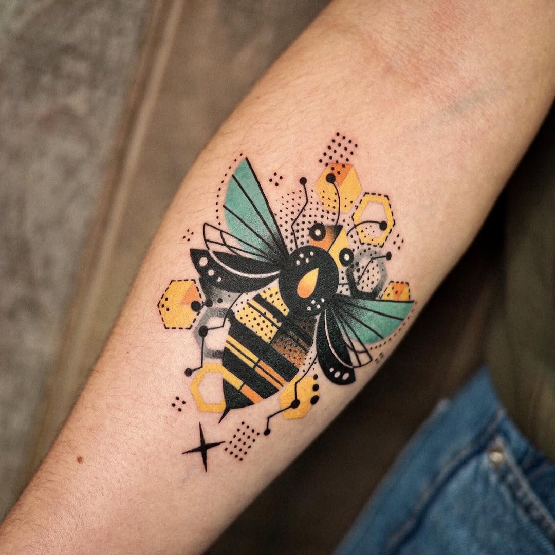 Stunning geometric bee tattoo with color accents